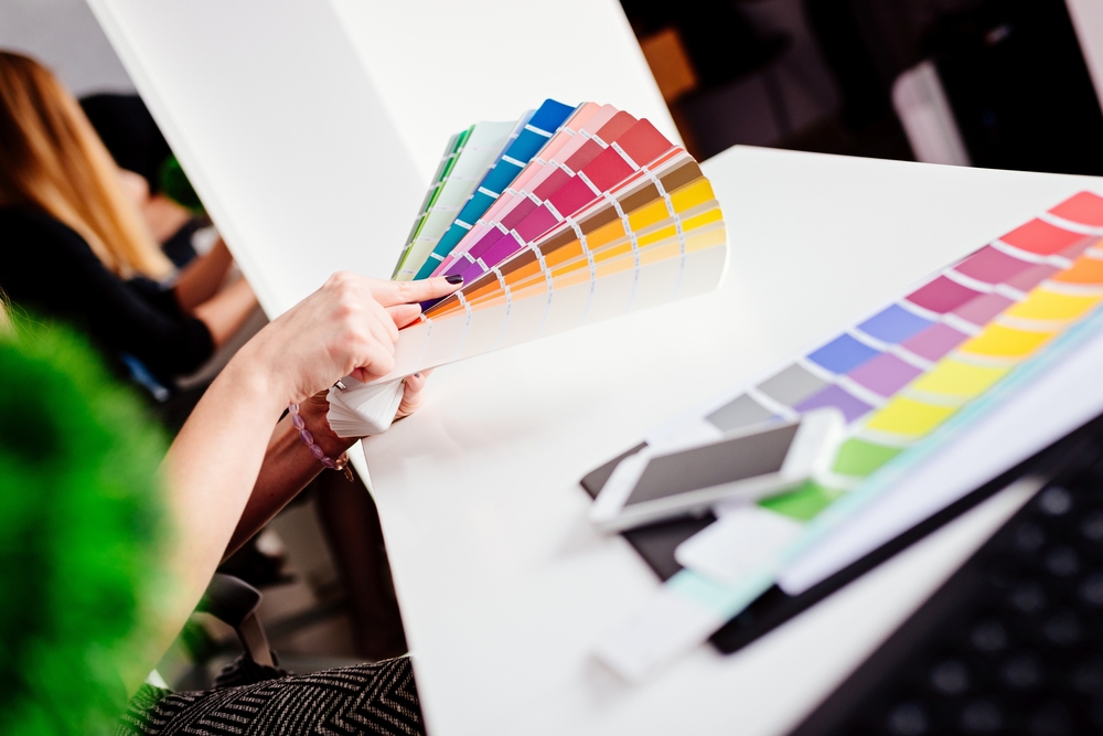 Colour swatch fan being used to choose interior paint colours in Hunter Valley